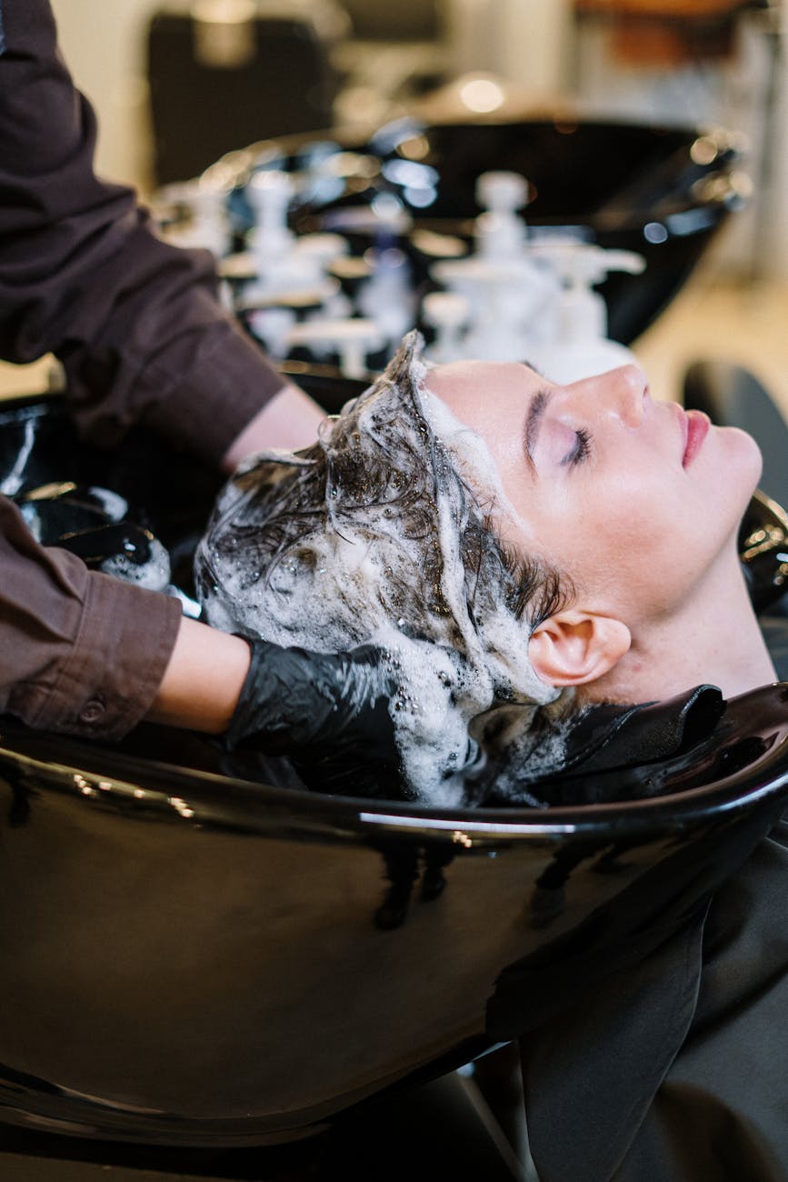 Your Go-To Hair Stylists and Salon Experience in Overland Park 1 person washing woman s hair