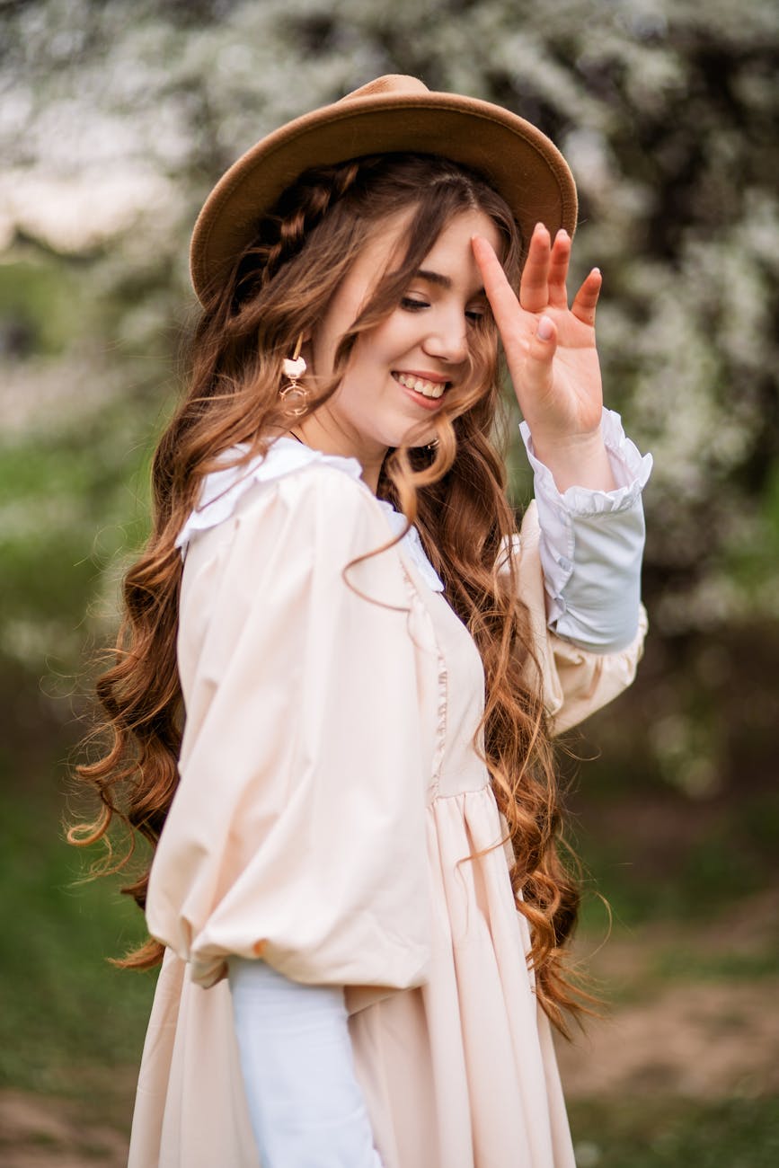 Spring Refresh: Shedding the Winter Weight at Just For Hair 1 portrait of smiling ginger hair young woman in hat