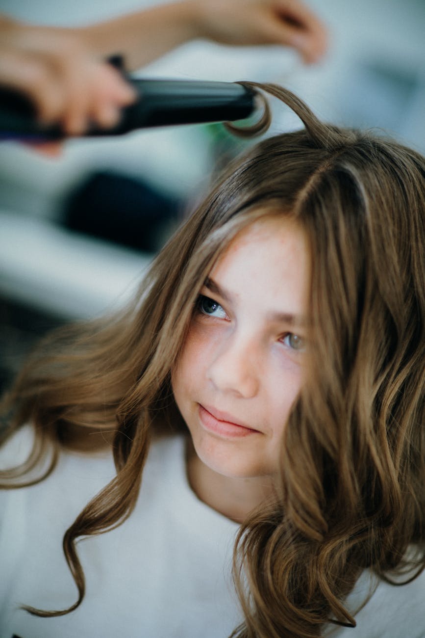 cute girl while making curls