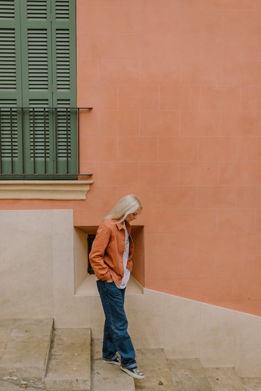 Peach Fuzz Tones: Incorporating 2026 Pastels into Natural Color 1 woman standing on stairs