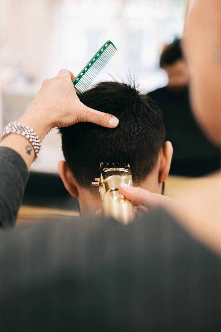 Ophair Luxe –VIP Hair Services 1 a hairdresser cutting mans hair