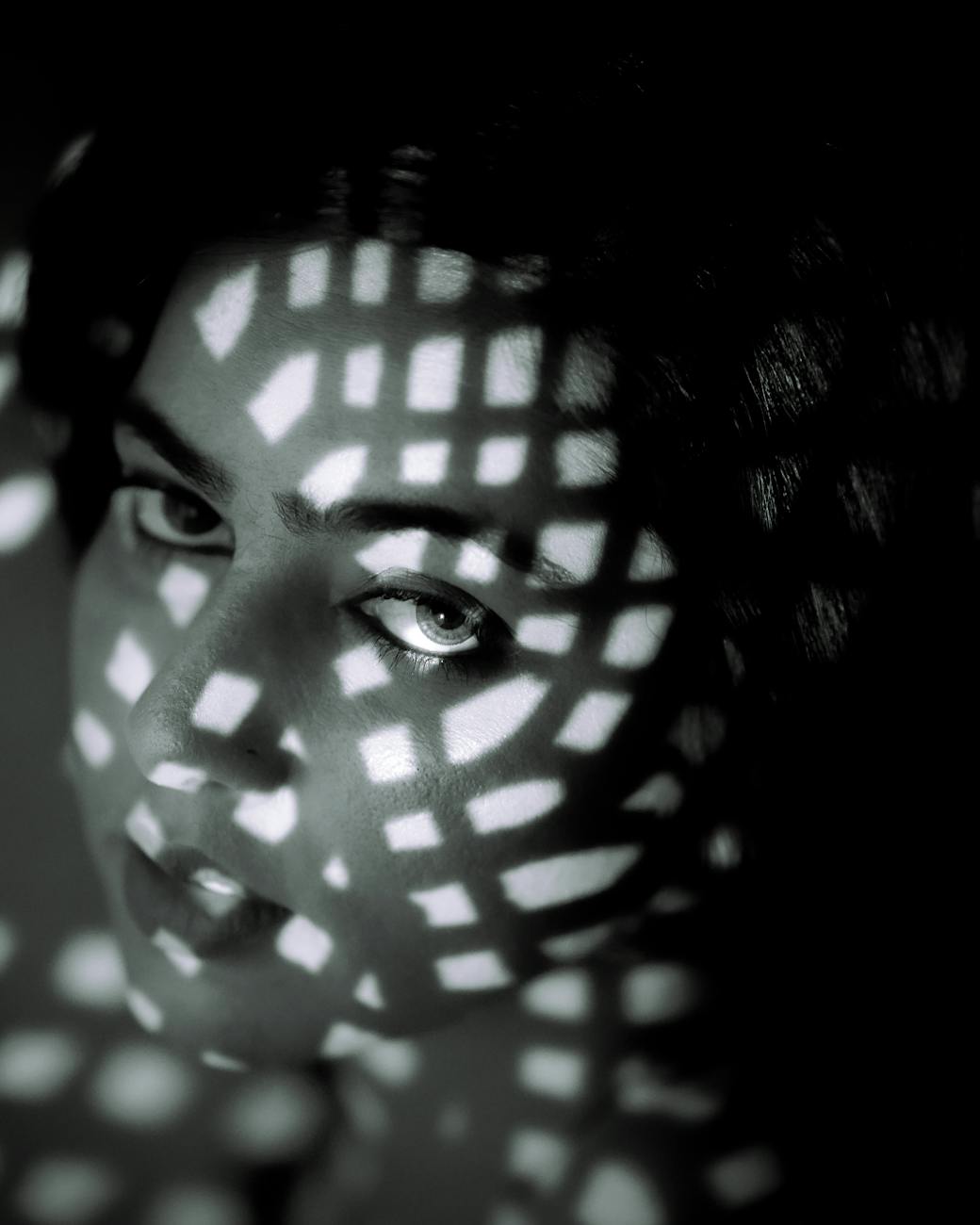 artistic black and white portrait with creative lighting