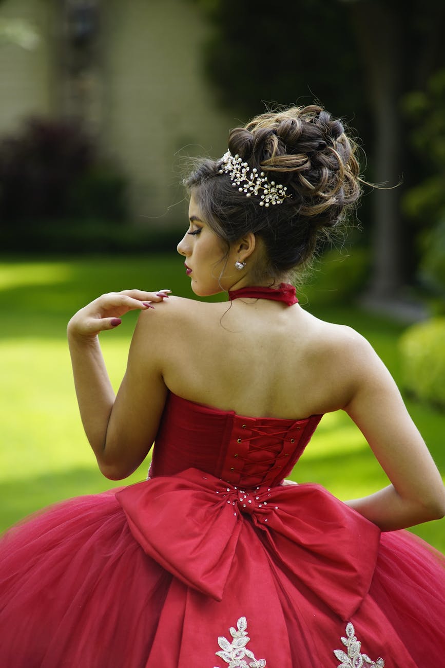 Prom Night Prep: The 2026 Lookbook at Just For Hair 1 a pretty woman in red dress posing