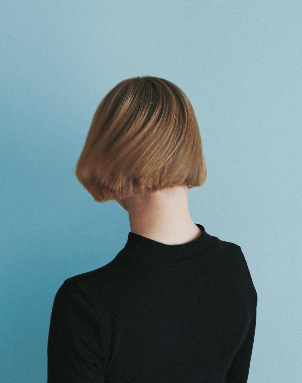 Strand Synthesis: The Future of Integrated Haircare in Overland Park 1 back view shot of a person with short hair wearing black shirt