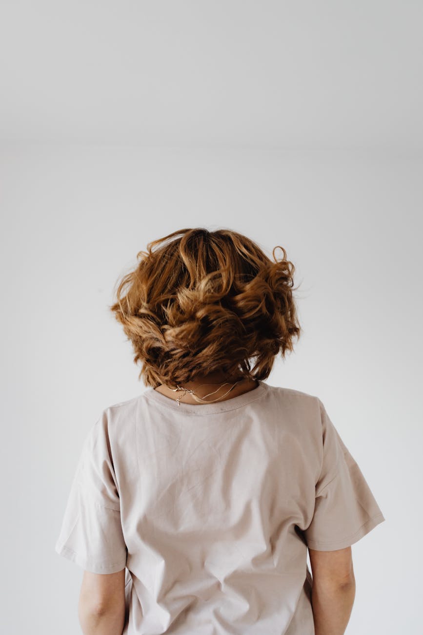 Soft Geometry: The 2026 Art of Structured Ease in Overland Park 1 back view of a short haired woman in beige shirt