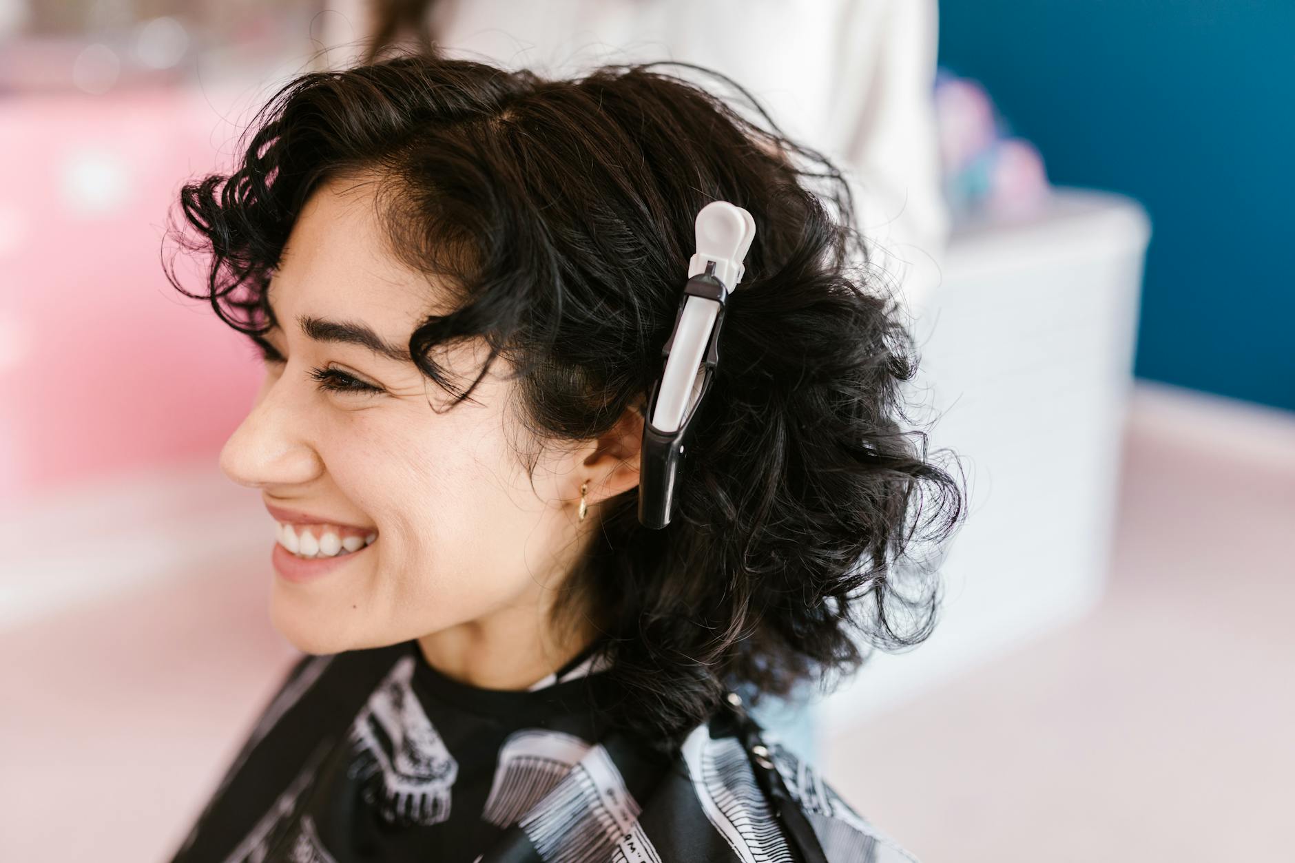 Claw Clip Chronicles: 10 Easy Looks at Just For Hair 1 curly haired woman with crocodile hair clip