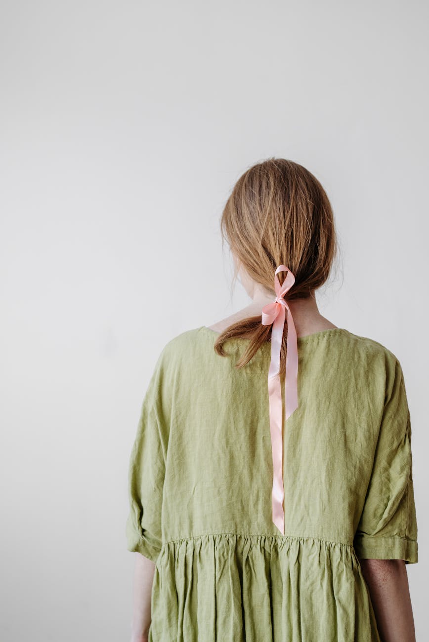Pastel Dreams: High-Maintenance Magic at Just For Hair 1 back view of woman in green dress