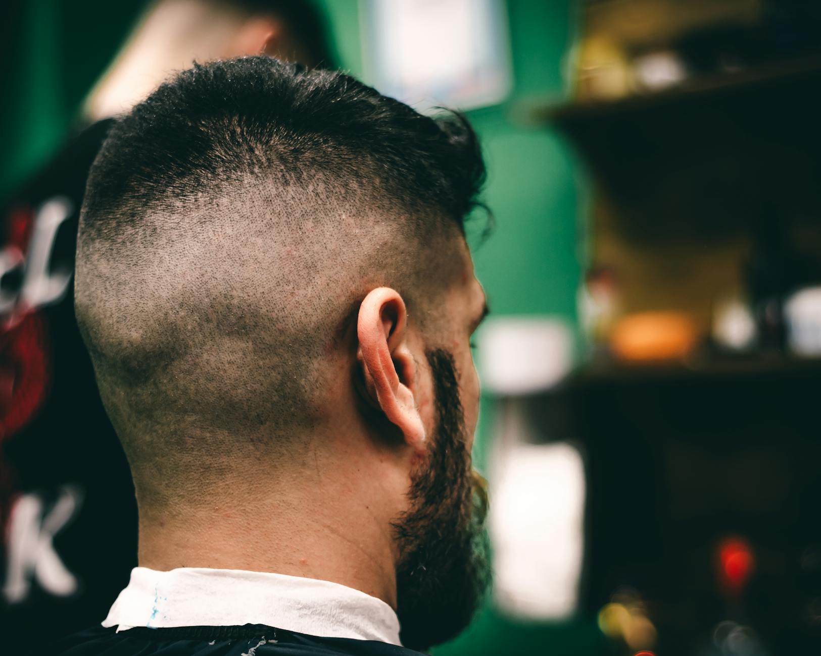 Mohawk – Mohawk Styling: Bold Geometry at Just For Hair 1 back view of man with black hair