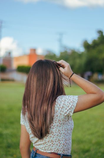 The Richness of Detail: Dimensional Brunette Hair Color Ideas 1 a woman wearing floral top