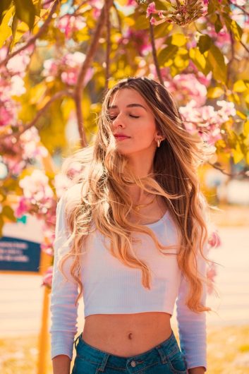 Balayage Perfection: Natural Highlights That Glow 1 photo of woman wearing white long sleeves