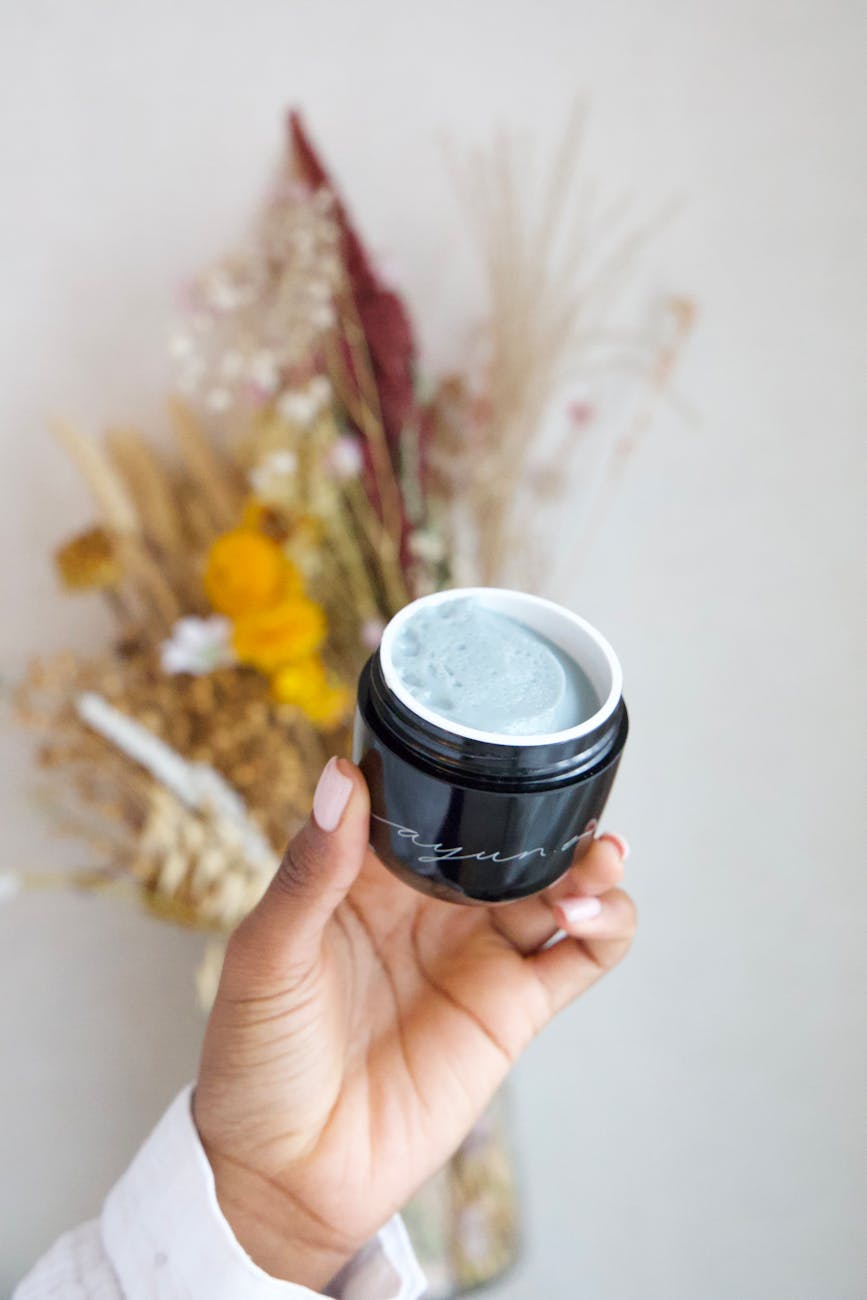 Thirst Quenching: Moisture Lock Hair Treatments for the Kansas Climate 1 woman holding a jar of cream