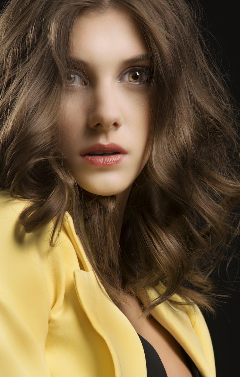 glamour brunette woman in yellow jacket