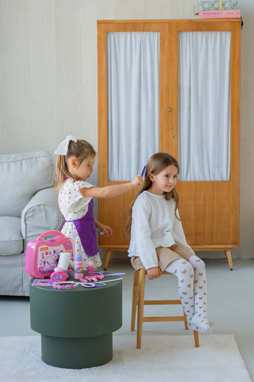 Reward – Kids' Loyalty Program: Growing Up with Style at Just For Hair 1 children playing hair salon game indoors