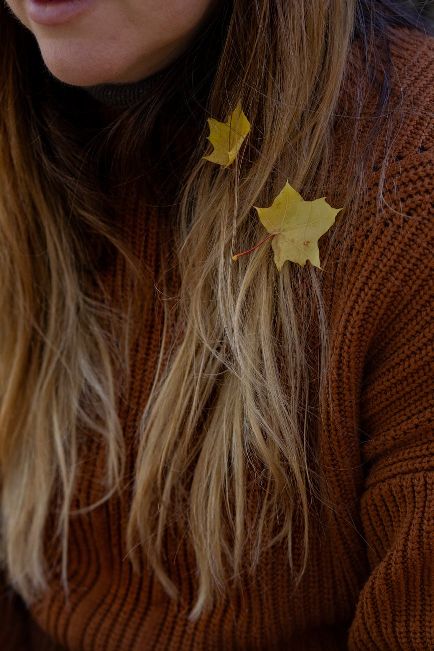 autumn leaves in blonde hair close up