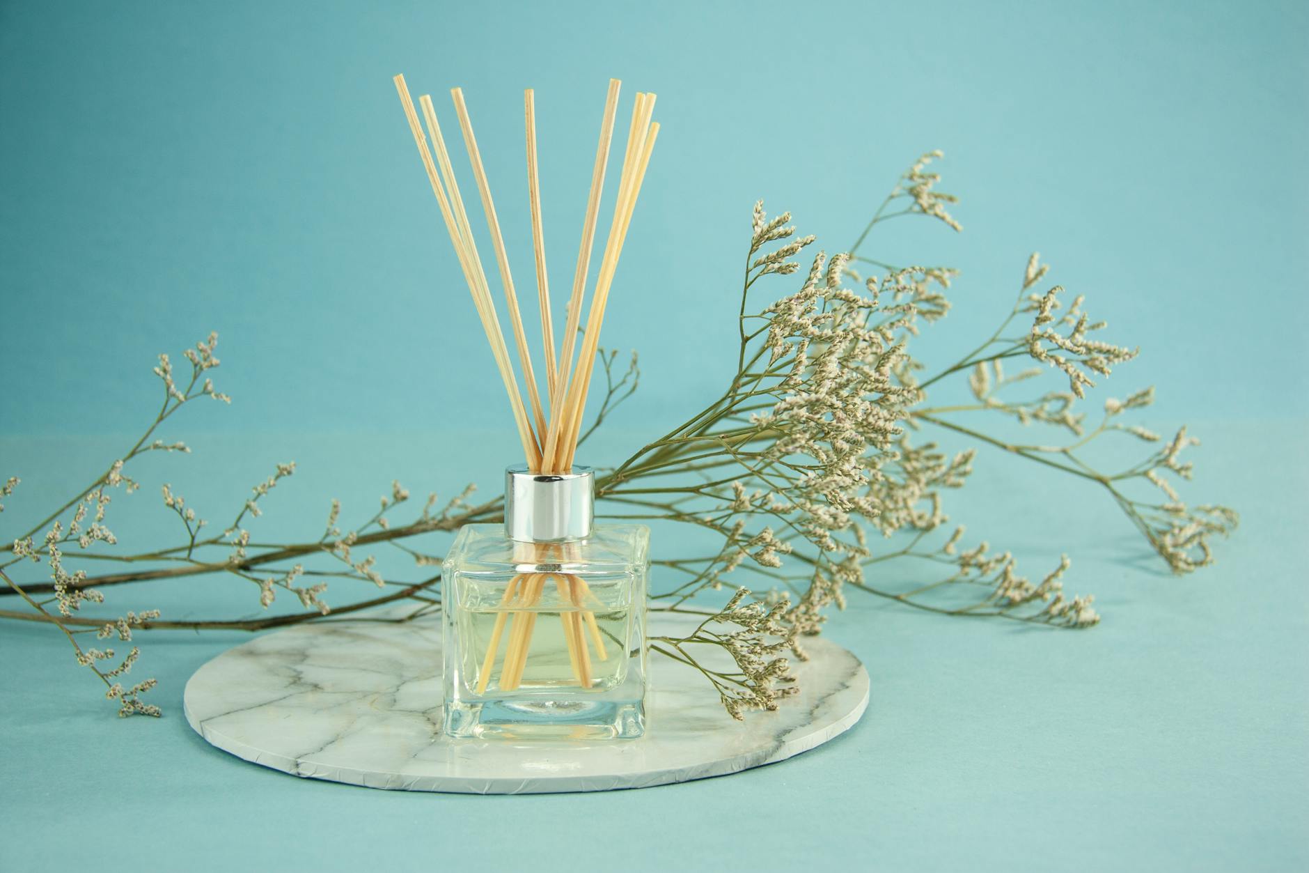 Breathe – Aromatherapy Styling: A Sensory Journey at Just For Hair 1 glass of natural essential oil with sticks