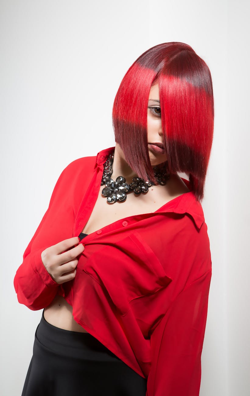 woman with red hair wearing red blazer