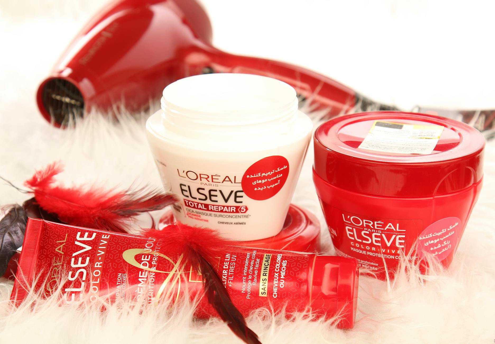Liquid Armor: Hair Hydration Solutions at Just For Hair 1 loreal products beside the red hair dryer