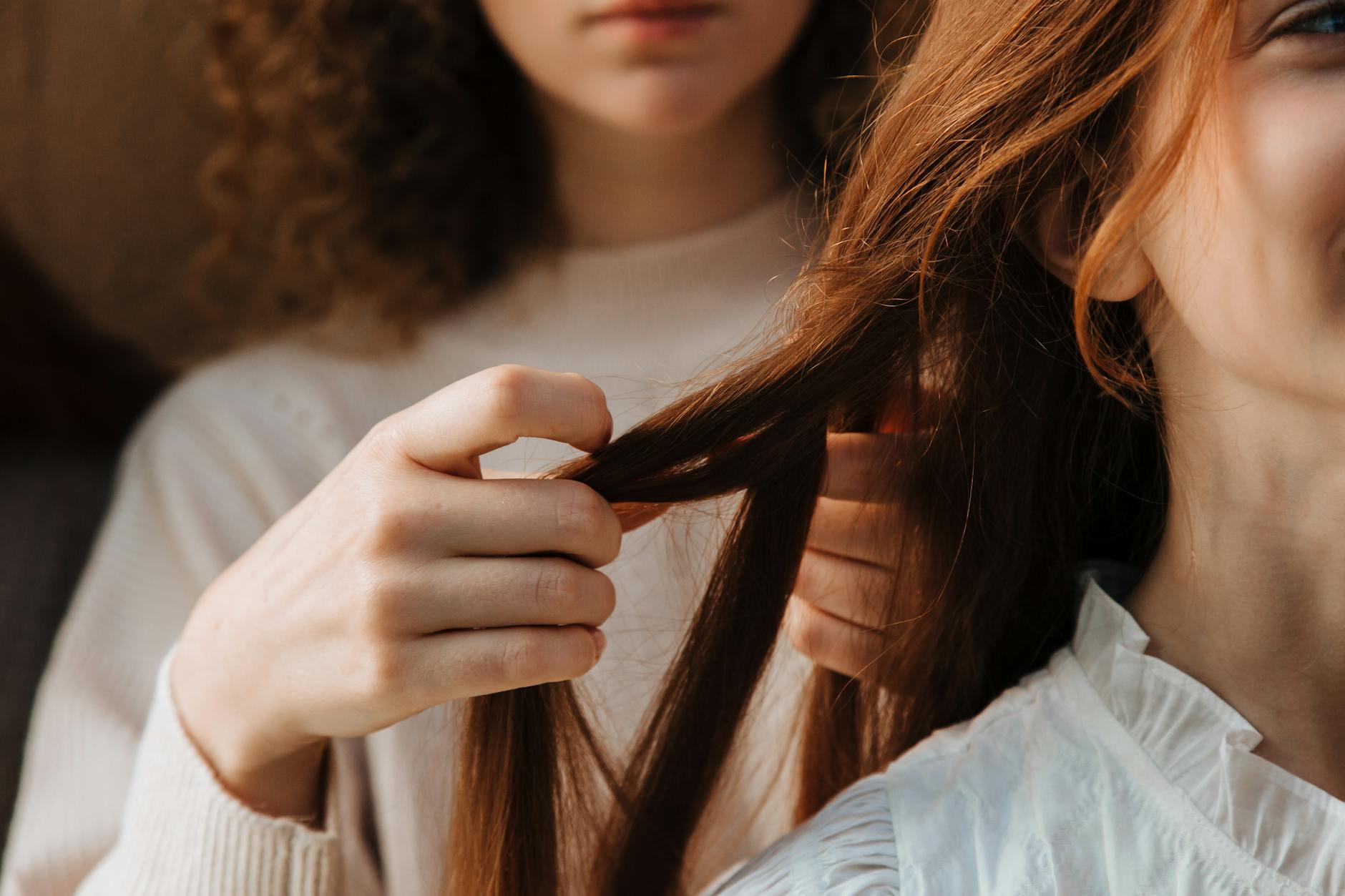 Deep Fortification: Hair Repair Therapy Designed for Weak Fragile Hair 1 close up of woman braiding friends hair