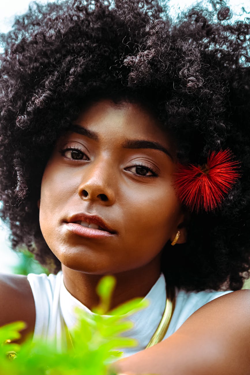 The Reveal: Haircuts That Enhance Natural Hair Beauty 1 a portrait of a woman looking at the camera