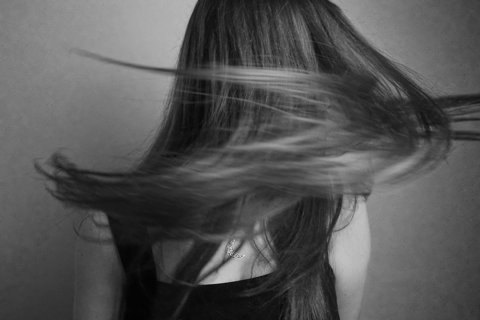 portrait of woman with motion of hair