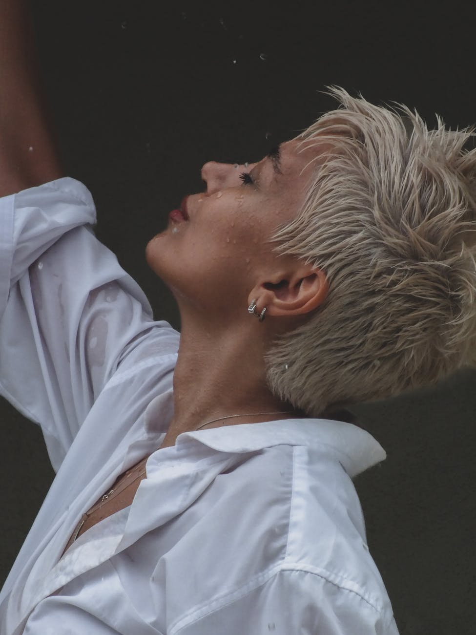 woman with wet blonde hair in profile