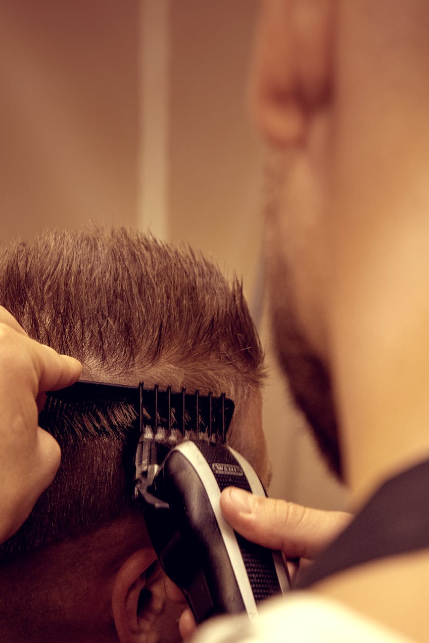 man trimming hair