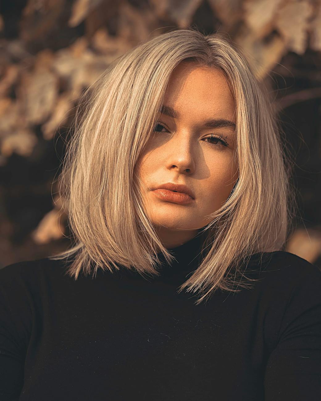 Low-Maintenance Luxury: Haircuts That Style Themselves 1 a beautiful woman in black shirt with shoulder length hair