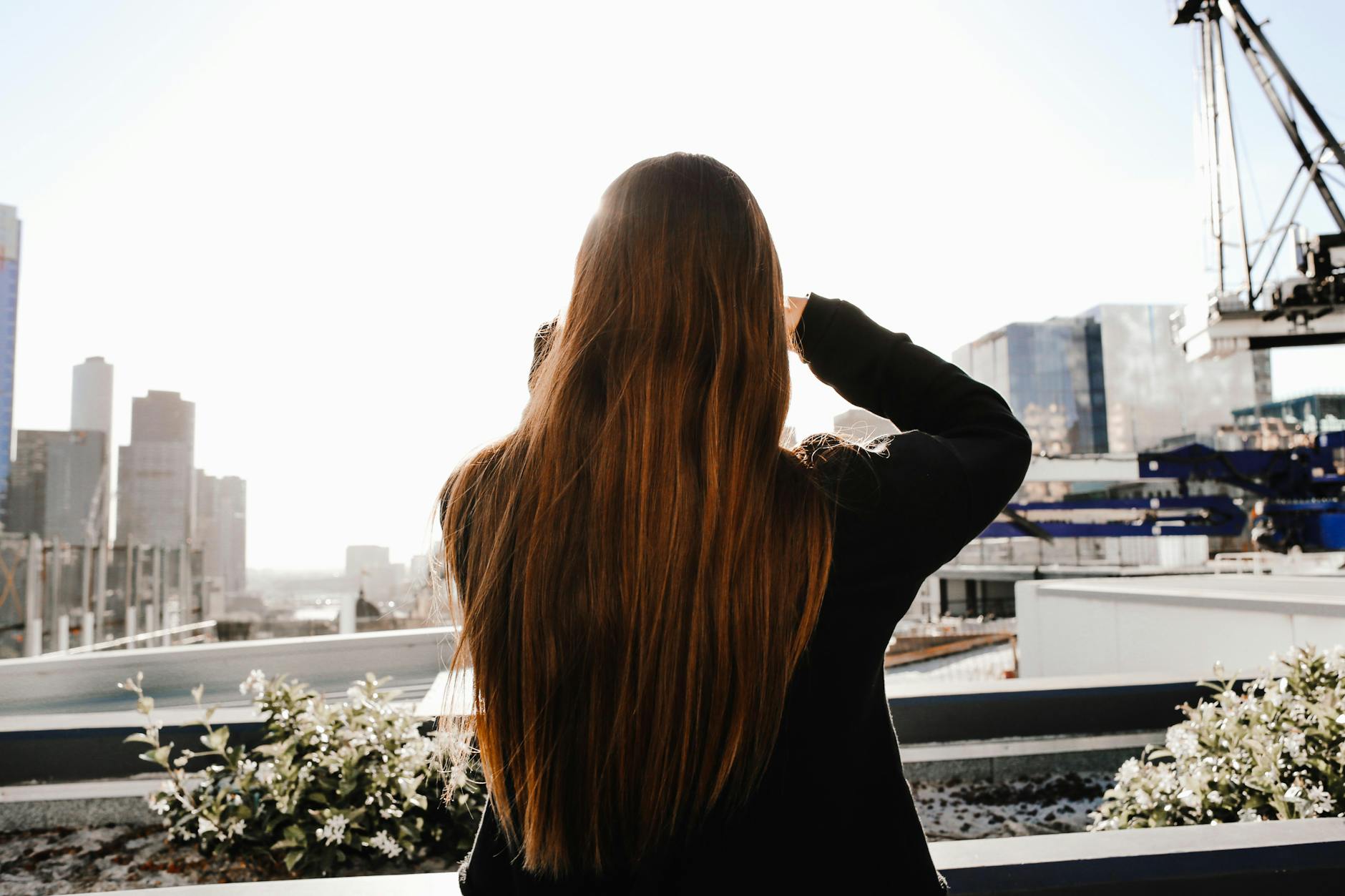 Bio-Integrity: Natural Hair Treatments for Strength and Shine 1 back view of a woman with long hair