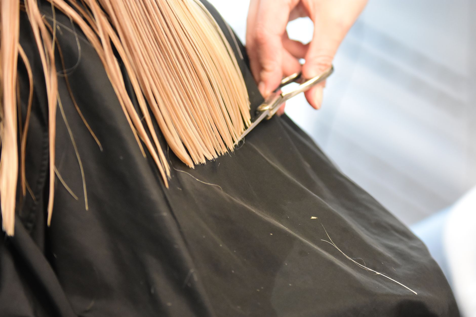 close up of woman getting her hair cut