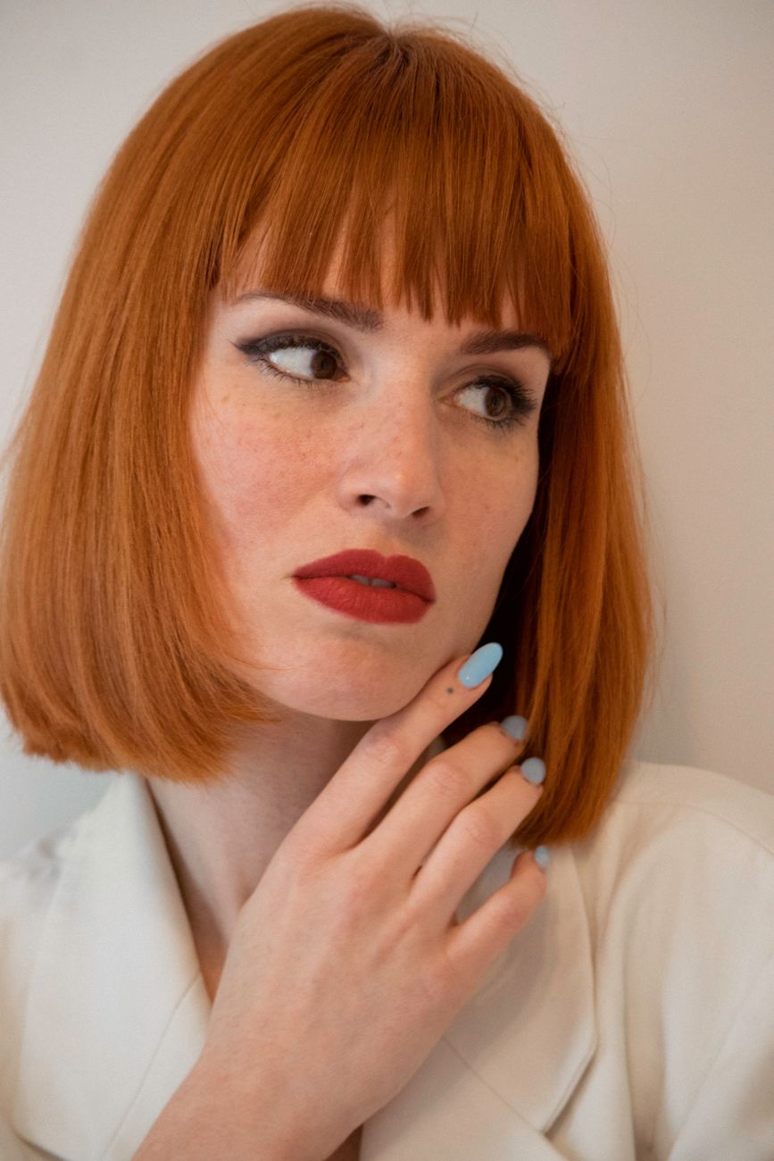 a woman in white blazer