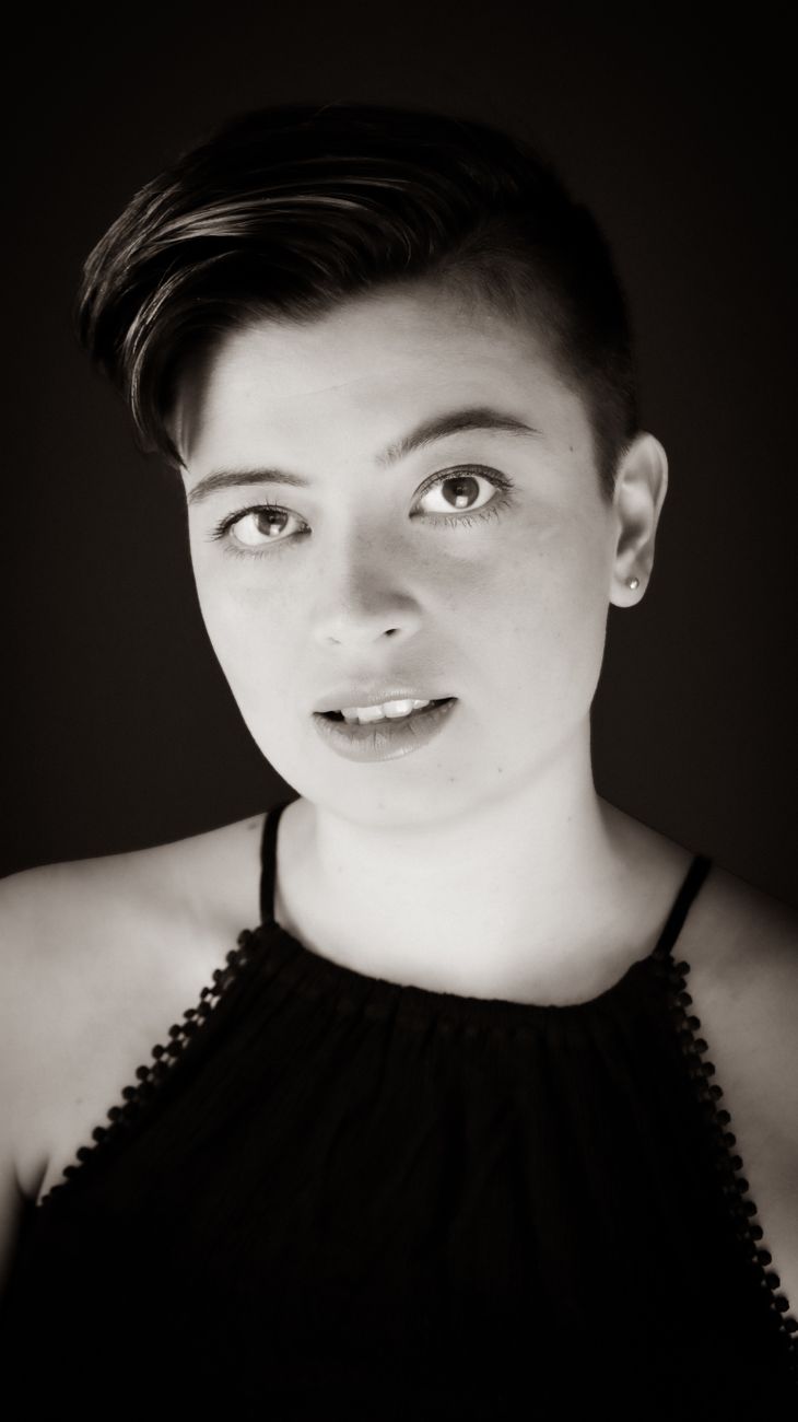 young woman with short hairstyle and sideshave