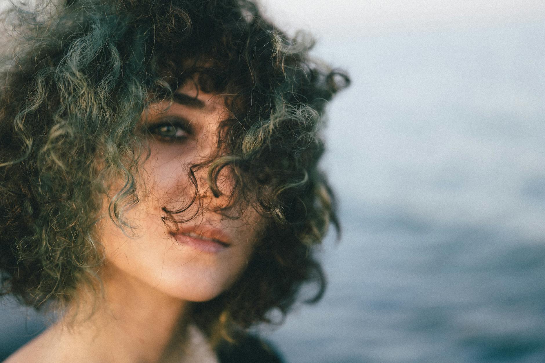 photo of a young woman with curly tousled hair