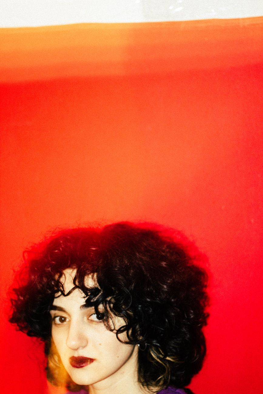 brunette woman with curly hair