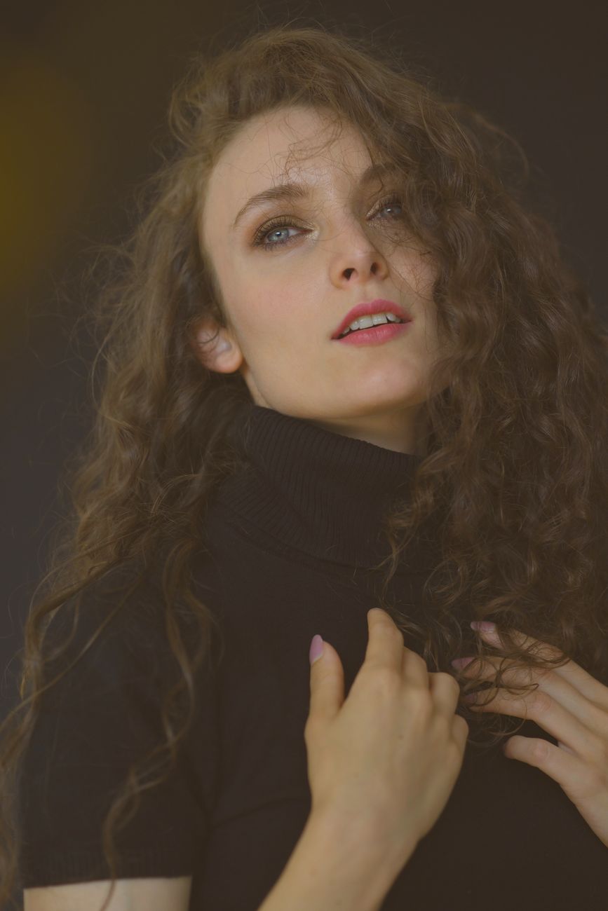 Restructuring Hair: How Modern Perm Formulae Protect Your Strands 1 elegant portrait of woman with curly hair