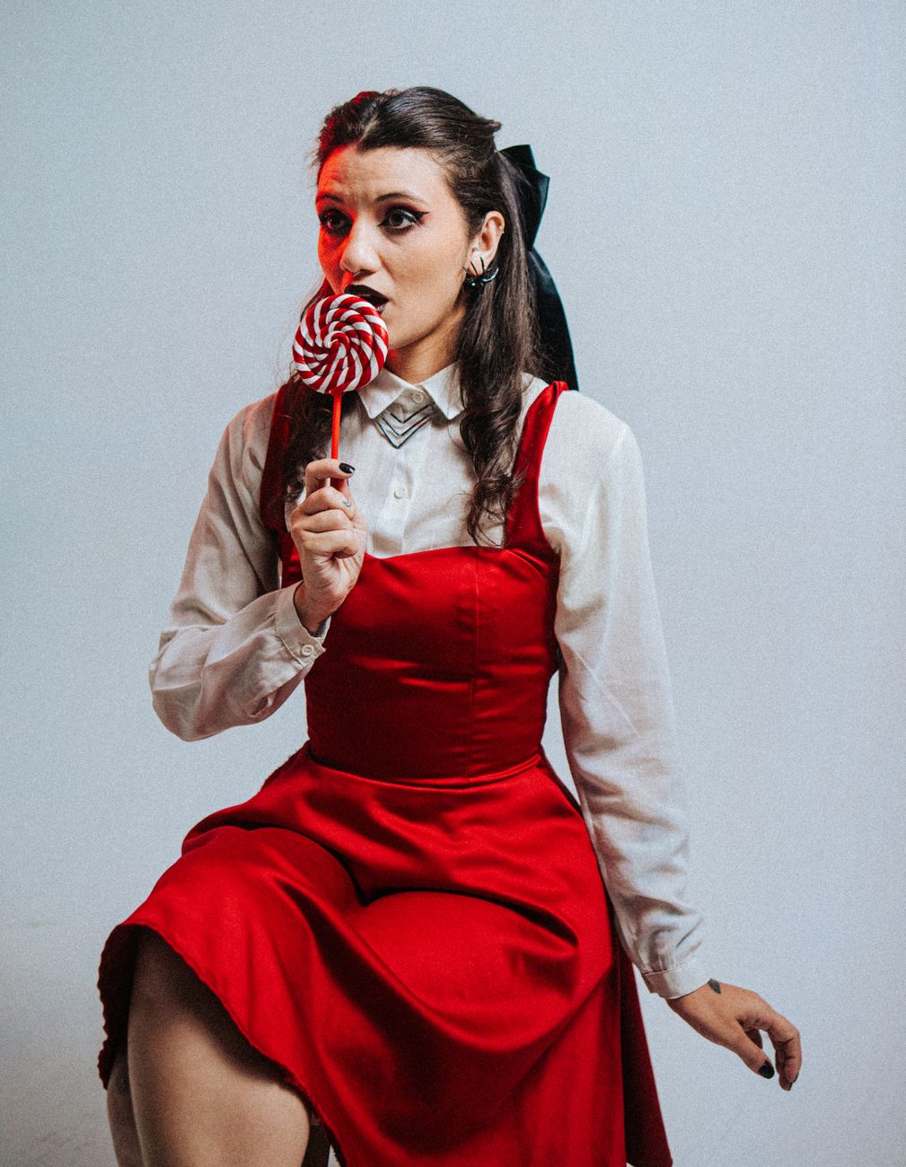 vintage style portrait of woman with lollipop
