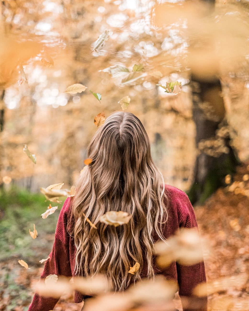 Autumn Glow: Copper and Bronze Infusions for Your Current Color 1 photo of woman wearing red sweater
