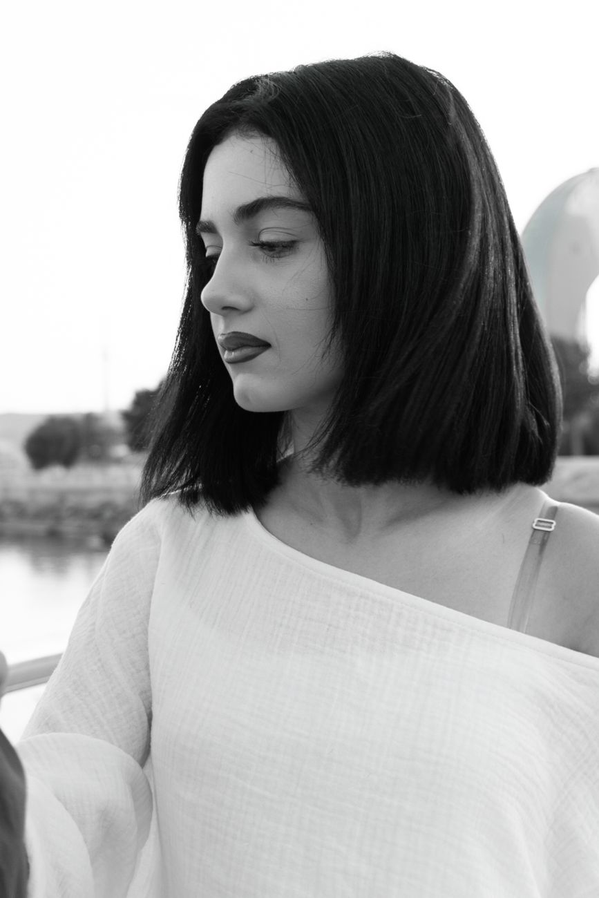 The French Bob: Effortless Chic for the Midwest Lifestyle 1 black and white portrait of a woman outdoors