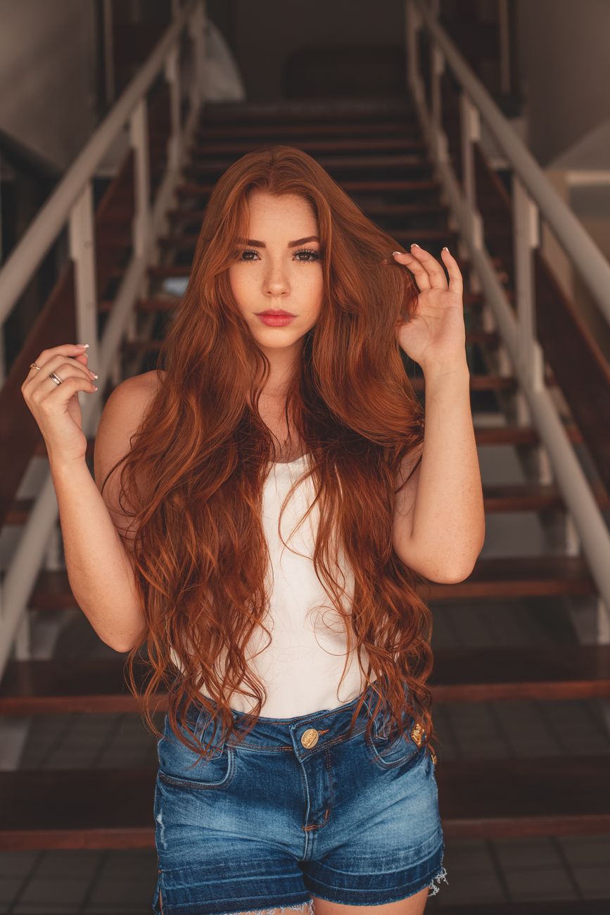 Cinnamon Spice: Rich Red and Copper Balayage Transformations 1 photo of woman wearing white tank top