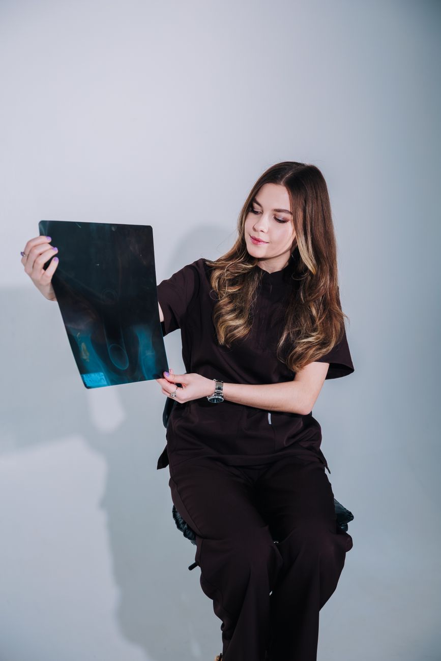 young female doctor examining x ray image