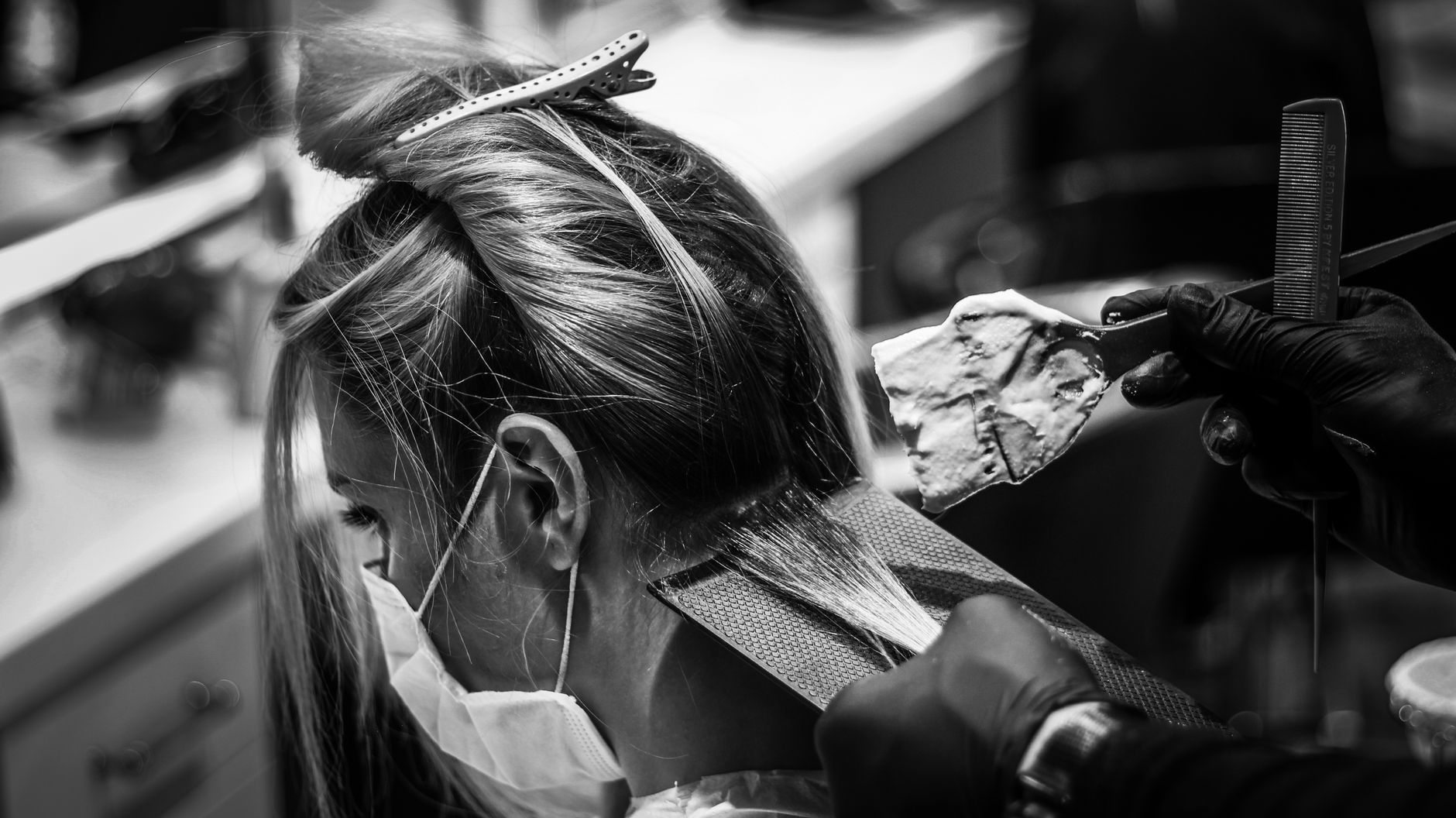 Barely-There Highlights: The Secret to Effortless Lived-In Color 1 grayscale photo of a woman getting a hair color