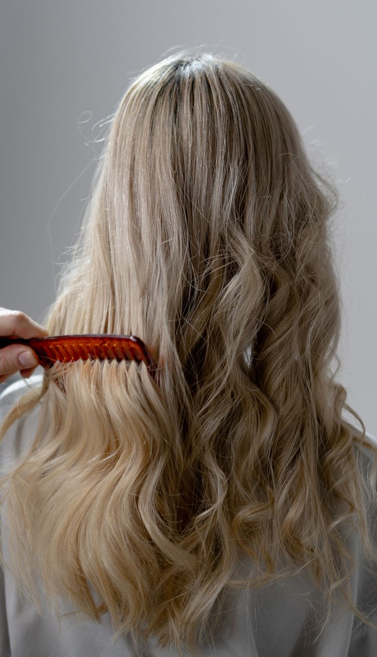 Demystifying Cold Wave Perms at Just For Hair Salon 1 woman with curly hair