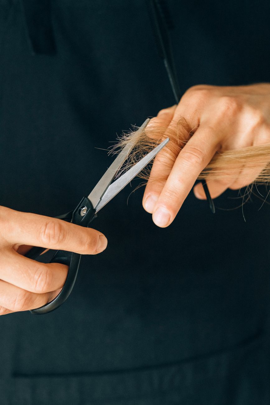 a person cutting hair