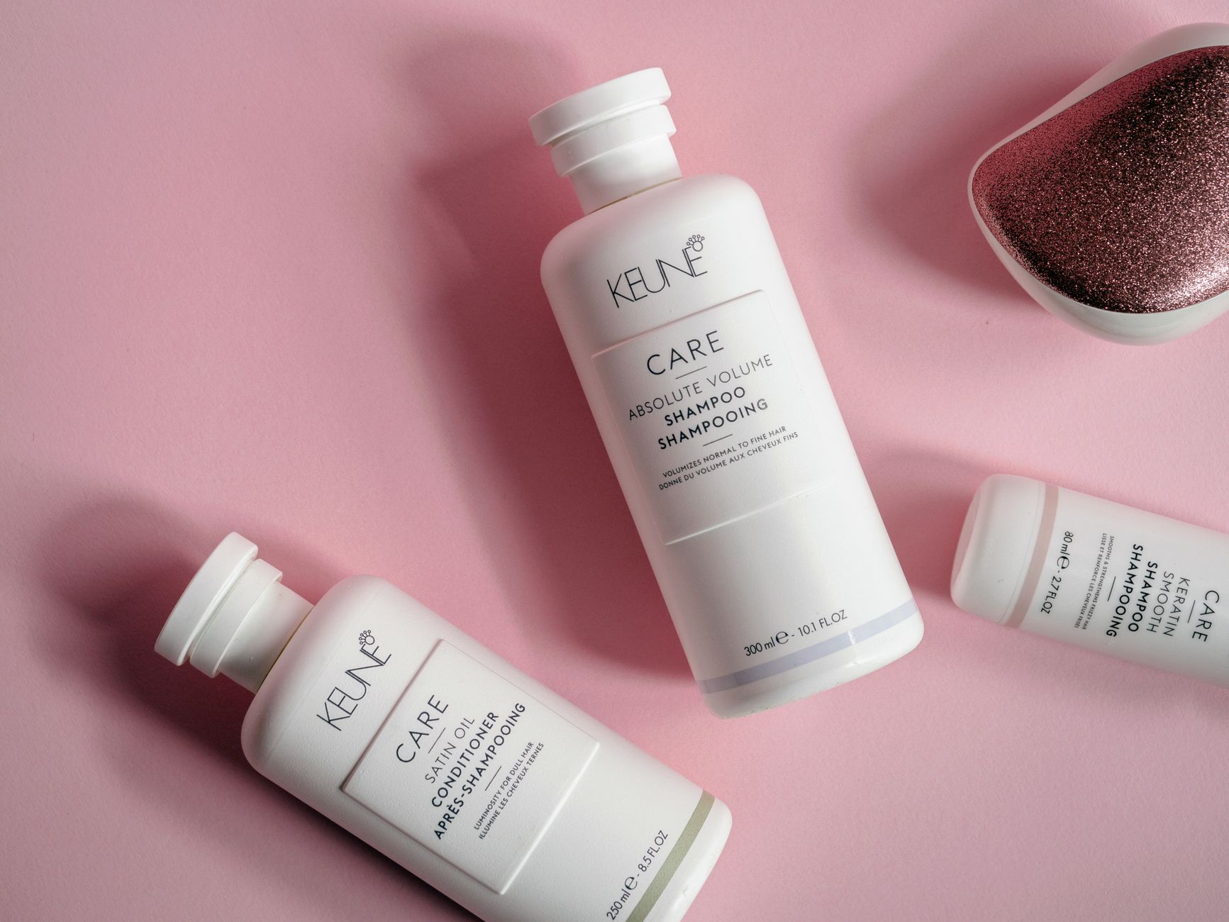 Fighting Follicular Aging: Vitamins and Topicals for Long-Term Hair Density 1 close up shot of beauty products on pink surface