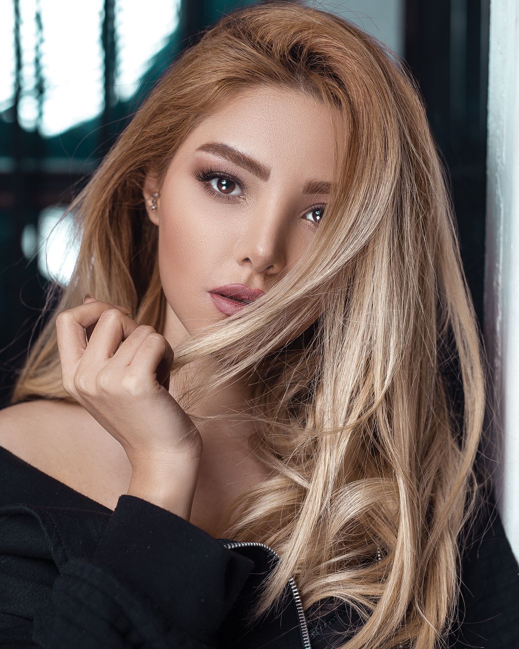 Reverse Balayage: Reclaiming Depth for the Cooler Months 1 portrait photo of woman wearing black top