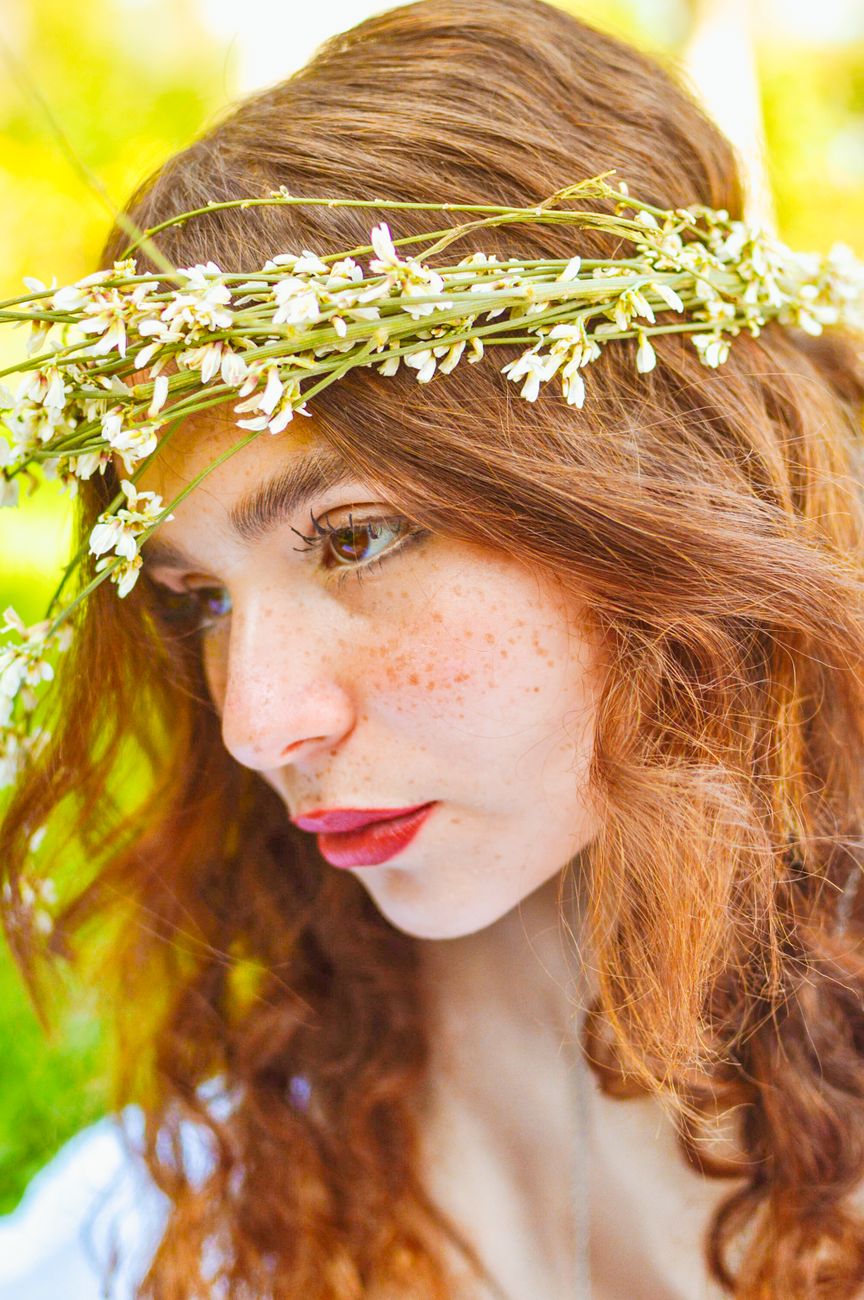 Customizing Color Melts: Combining Balayage with Root Shadowing 1 red haired woman with floral crown portrait