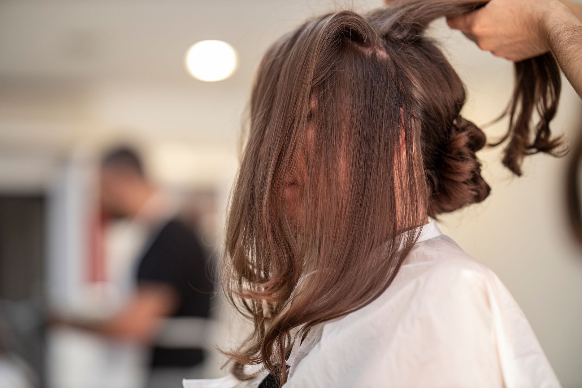 Why Good Hair Artistry Takes Time: The Realities of Multi-Hour Processing 1 shallow focus photo of person fixing hair