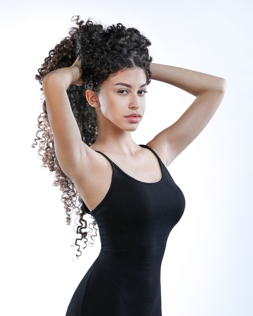 Heat Damage Rehabilitation: Can Burned Curly Hair Ever Bounce Back? 1 elegant portrait of woman with curly hair