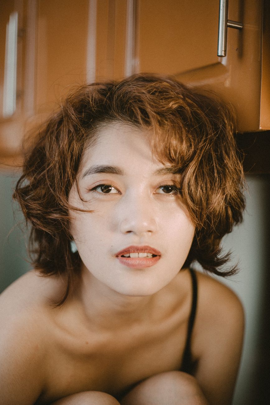 The Wavy Hair Awakening: How to Uncover Hidden Waves in Your Heavy Layers 1 portrait photo of a woman