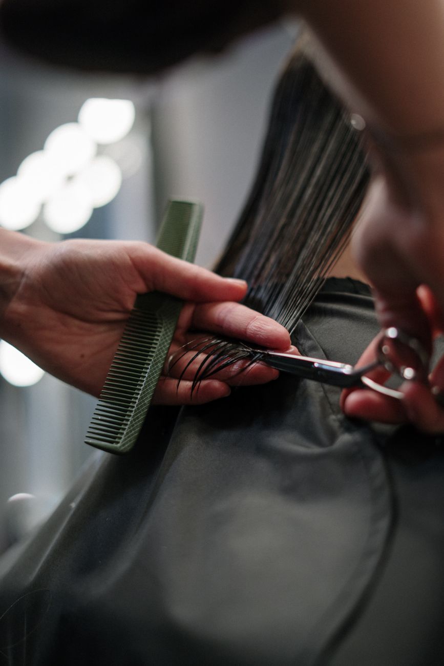 Softening Concrete Lines: Adding Movement to Super Dense Strands 1 person holding black hair comb