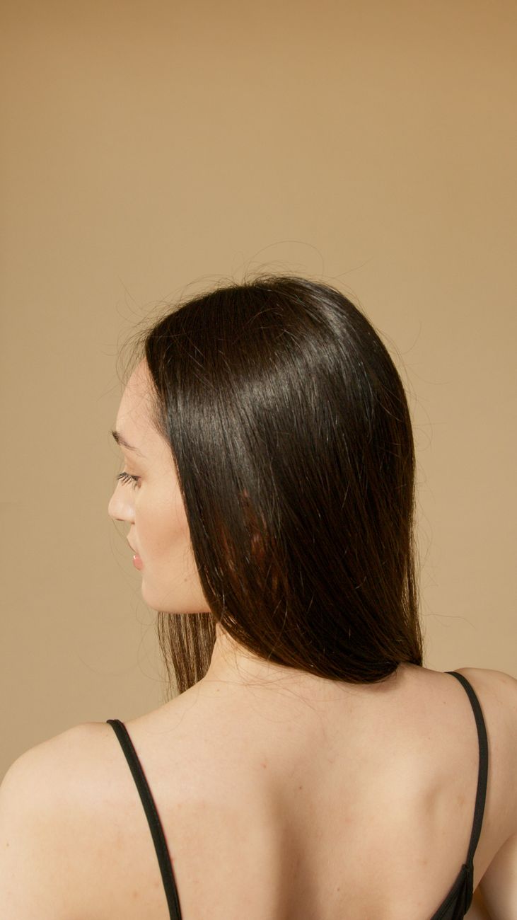 a woman in black spaghetti strap top